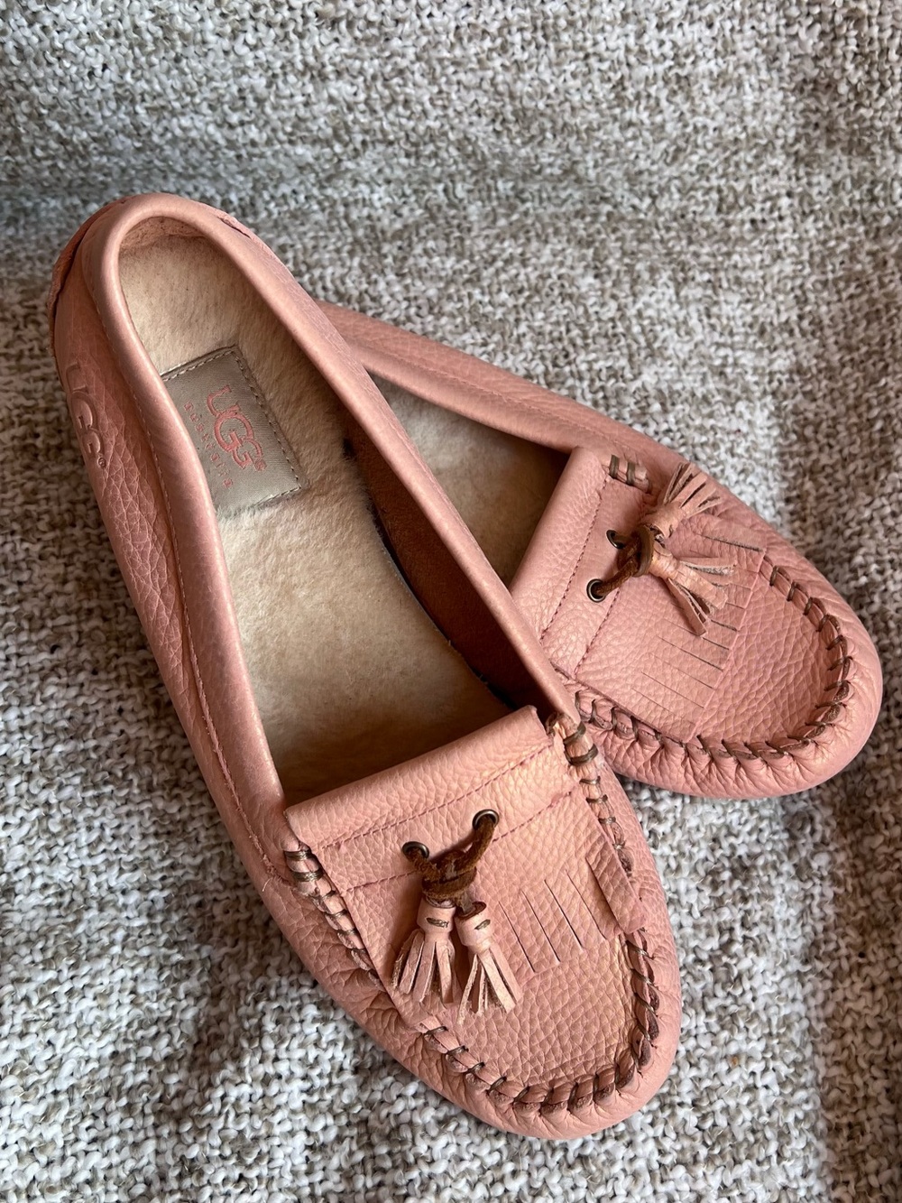 Women’s size 10 UGG Pink Leather Tassel Moccasin Slippers